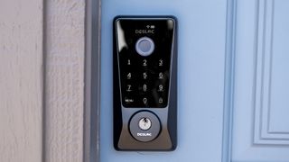 Exterior shot of the Desloc D110 Plus mounted on a blue door