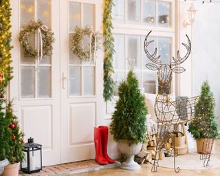 Reindeer Lighted Display at a front door - wayfair