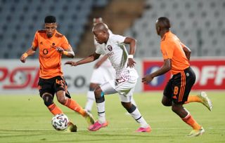 Kgaogelo Sekgota of Swallows FC challenged by Vincent Pule and Siphesihle Ndlovu of Orlando Pirates