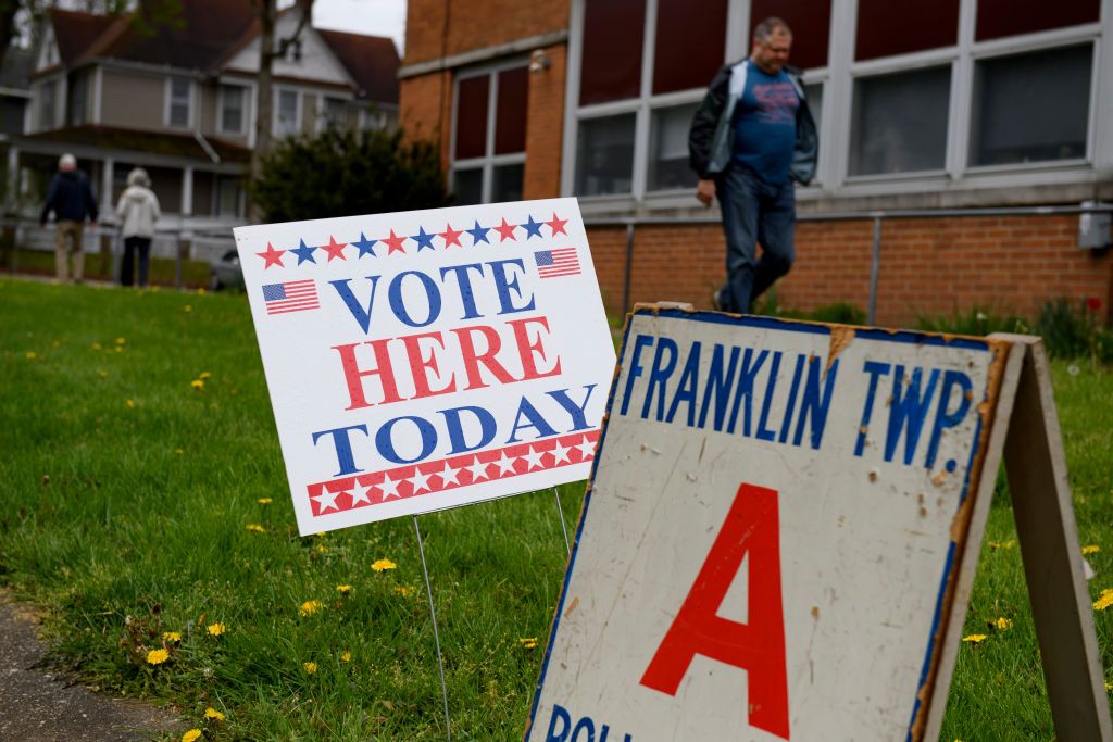 Sign on the lawn of a polling place.