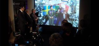 2019 Nobel Prize laureates in physics, Didier Queloz and Michel Mayor, and the Nobel Prize laureate in chemistry, Stanley Whittingham, talk the secrets of the universe with astronauts Jessica Meir (left) of NASA and Luca Parmitano of the European Space Agency during a Dec. 6, 2019 call to celebrate Nobel week in Stockholm, Sweden.