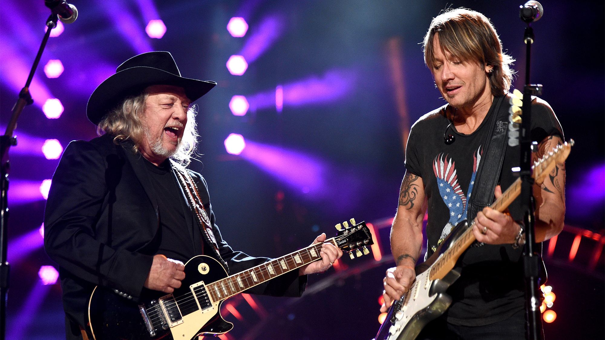 Musicians John Anderson (L) and Keith Urban perform onstage during ACM Presents: Superstar Duets at Globe Life Park in Arlington on April 18, 2015 in Arlington, Texas.