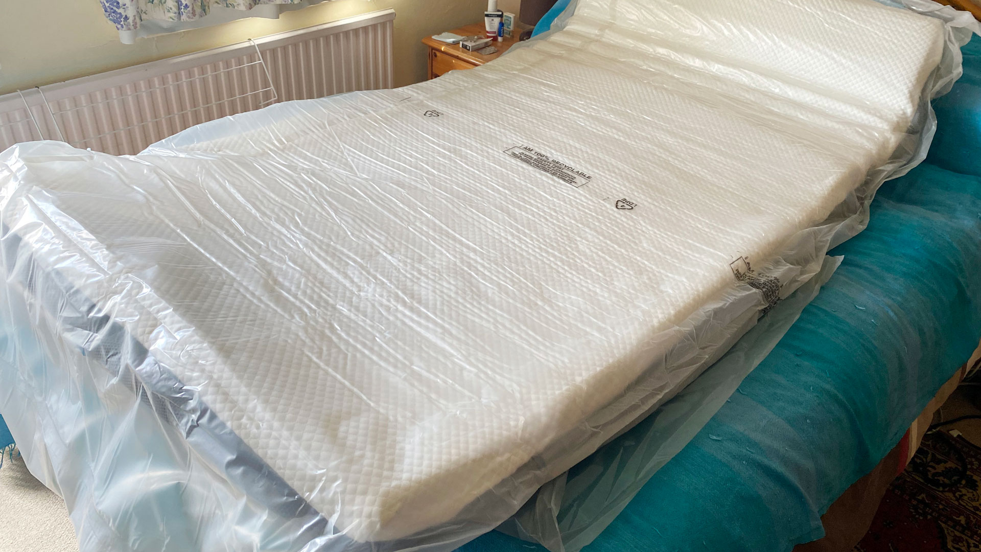A Simbatex Foam Mattress laid out in its bag
