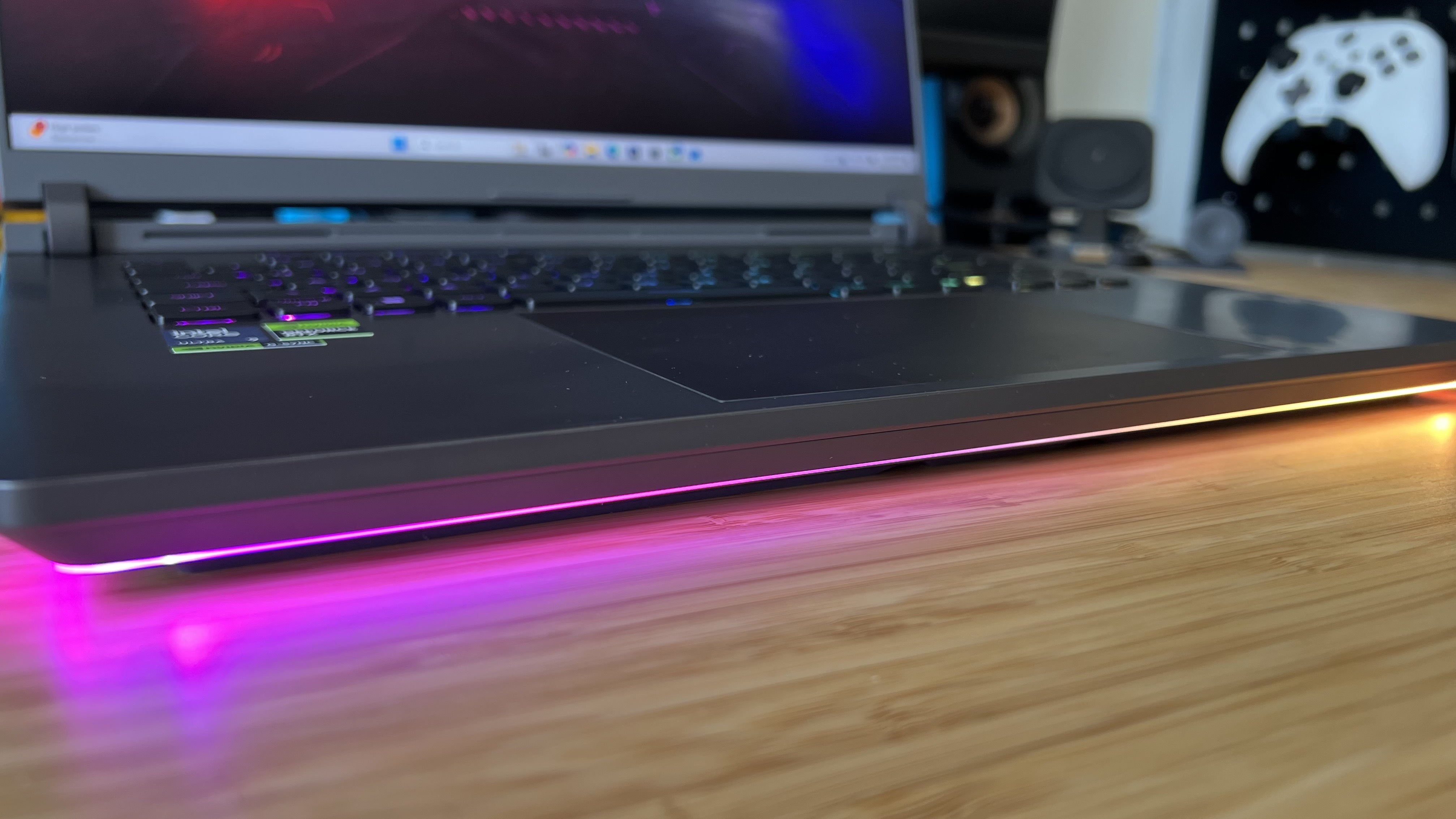 Close up on RGB light strip underneath the Asus ROG Strix G16 gaming laptop