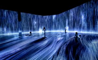 People in a hall surrounded by a water effect