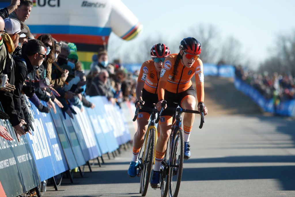 FAYETTEVILLE ARKANSAS JANUARY 29 LR Marianne Vos of Netherlands and Lucinda Brand of Netherlands compete while fans cheer 73rd UCI CycloCross World Championships Fayetteville 2022 Womens Elite Fayetteville2022 on January 29 2022 in Fayetteville Arkansas Photo by Chris GraythenGetty Images