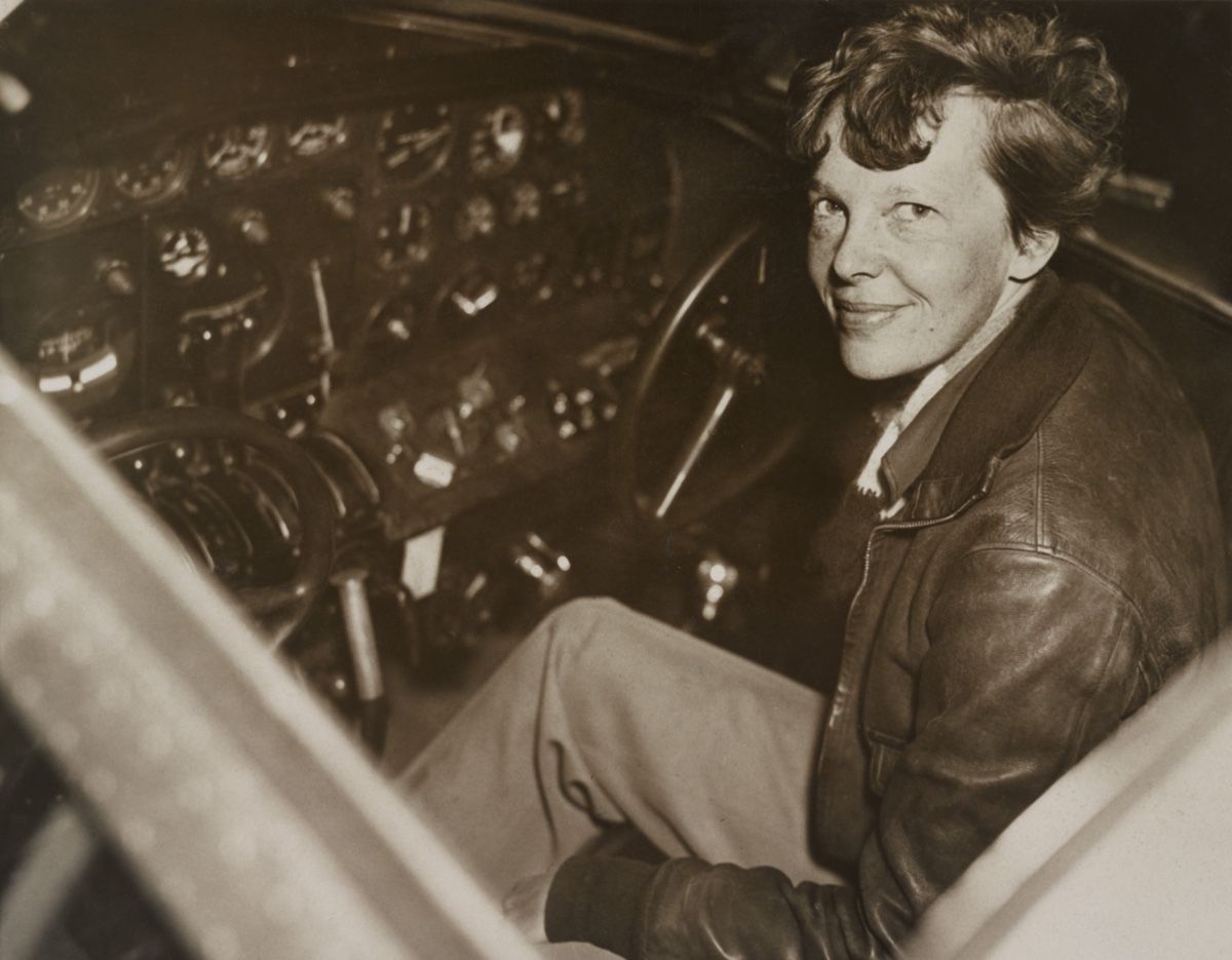 Amelia Earhart sitting in the cockpit of her Lockheed Electra airplane. In July 1937, Earhart and the plane were last seen on July 2, 1937 over the Pacific Ocean.