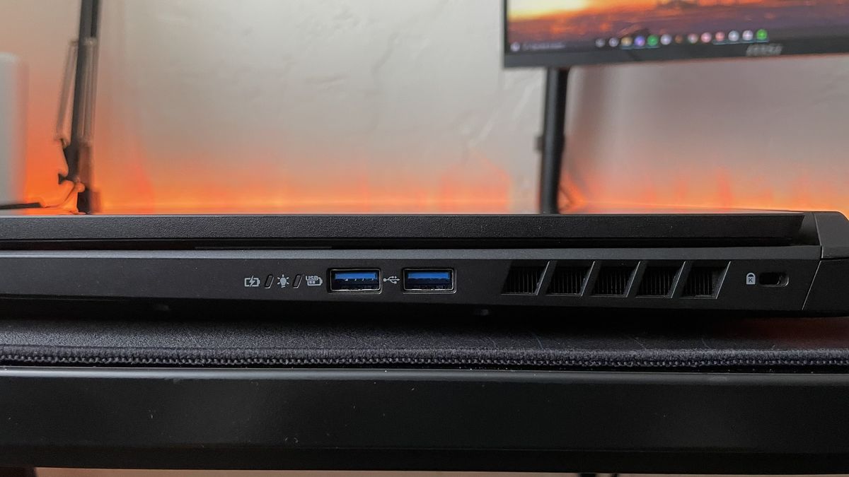 Close-up of the ports on the right edge of the Acer Nitro 17 on a black desk.