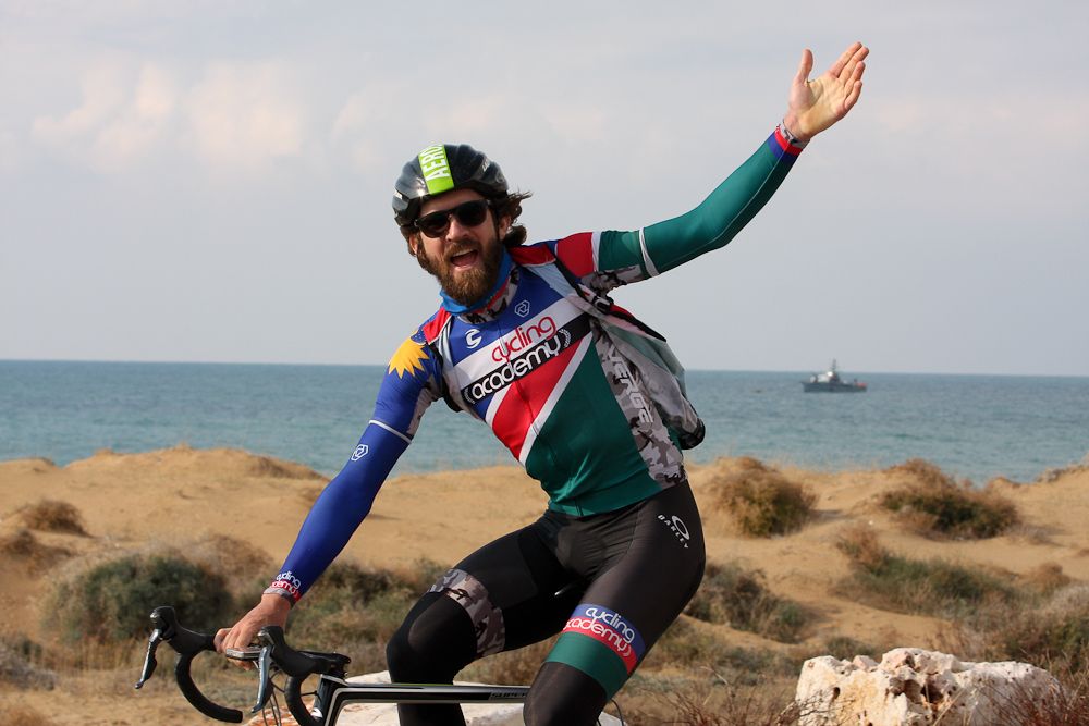 With a Israeli Navy Patrol boat in the Background, Namibian champion Dan Craven enjoys the sunshine along the Mediterranean coast.