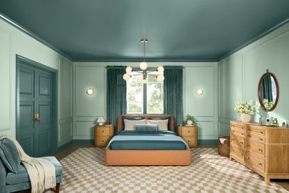 blue and sage bedroom with checkerboard rug