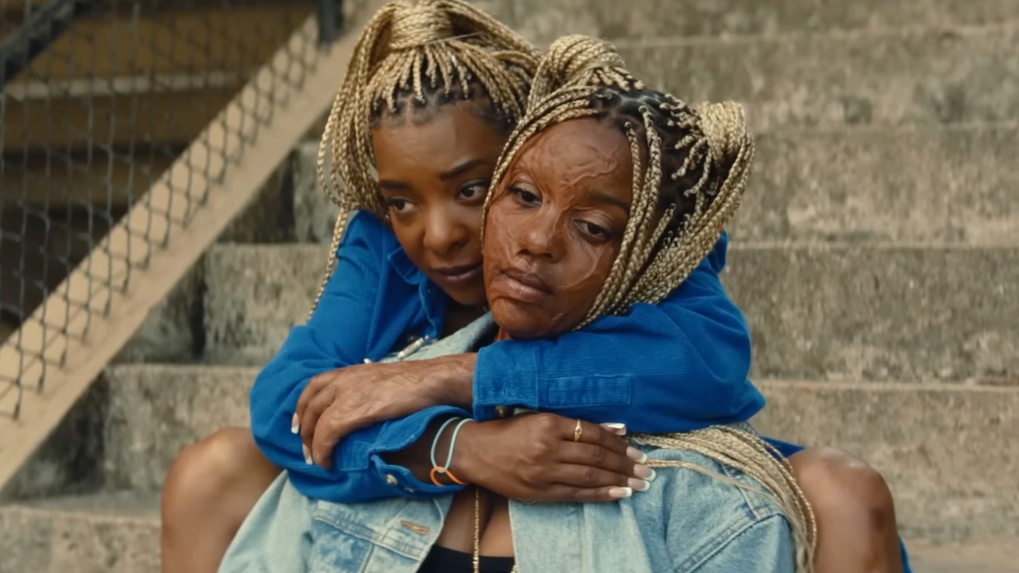 Kara Young and Mallori Johnson hugging in Is God Is.