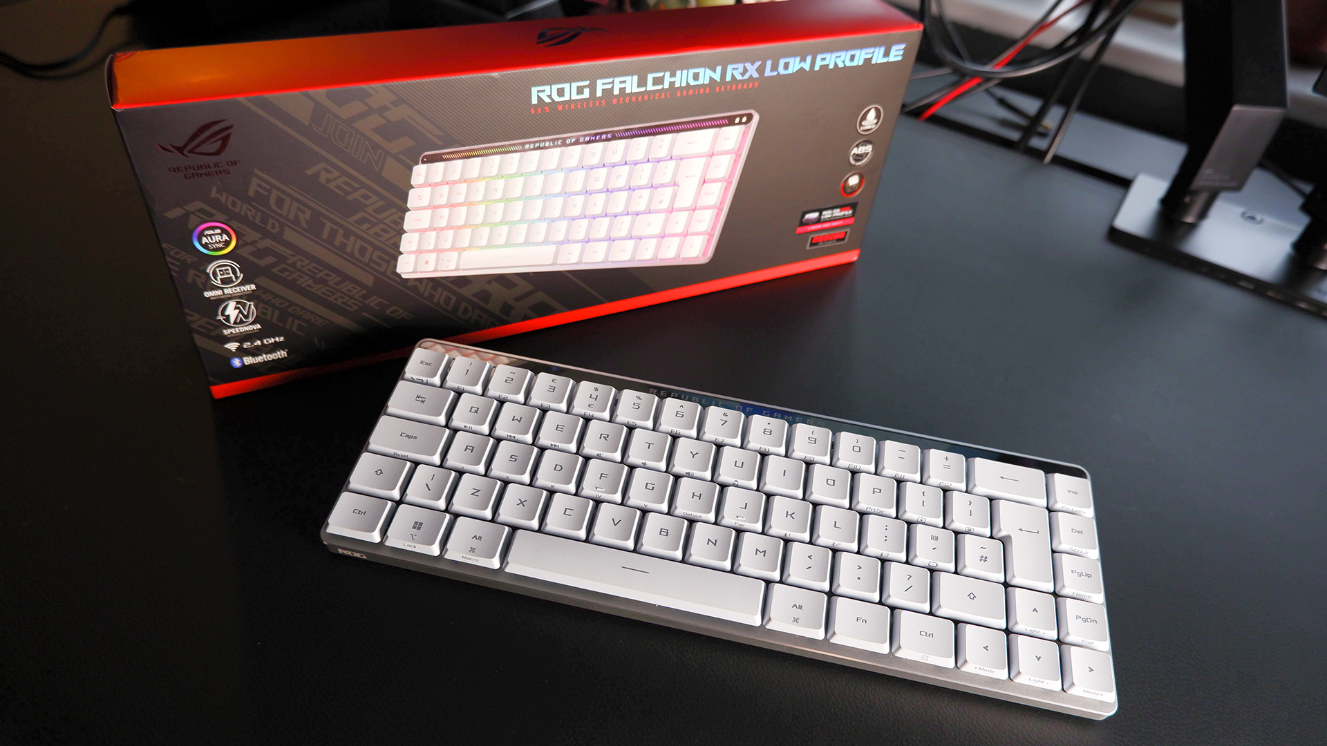 The ROG Falchion RX gaming keyboard in white set up on a desk.