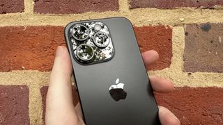 iPhone 15 Pro with a titanium finish running iOS 17