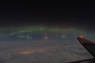 Skywatchers Imelda B. Joson and Edwin L. Aguirre spotted the aurora on March 8, 2012, while travelling on a commercial flight. They write: "We were on our way from Boston to Los Angeles at the time ... somewhere over Minnesota."