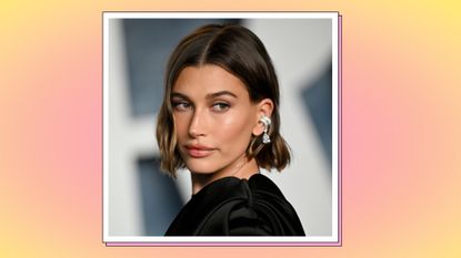  Hailey Rhode Bieber pictured wearing a black dress as she attends the 2023 Vanity Fair Oscar Party Hosted By Radhika Jones at Wallis Annenberg Center for the Performing Arts on March 12, 2023 in Beverly Hills, California. / in a yellow and pink template