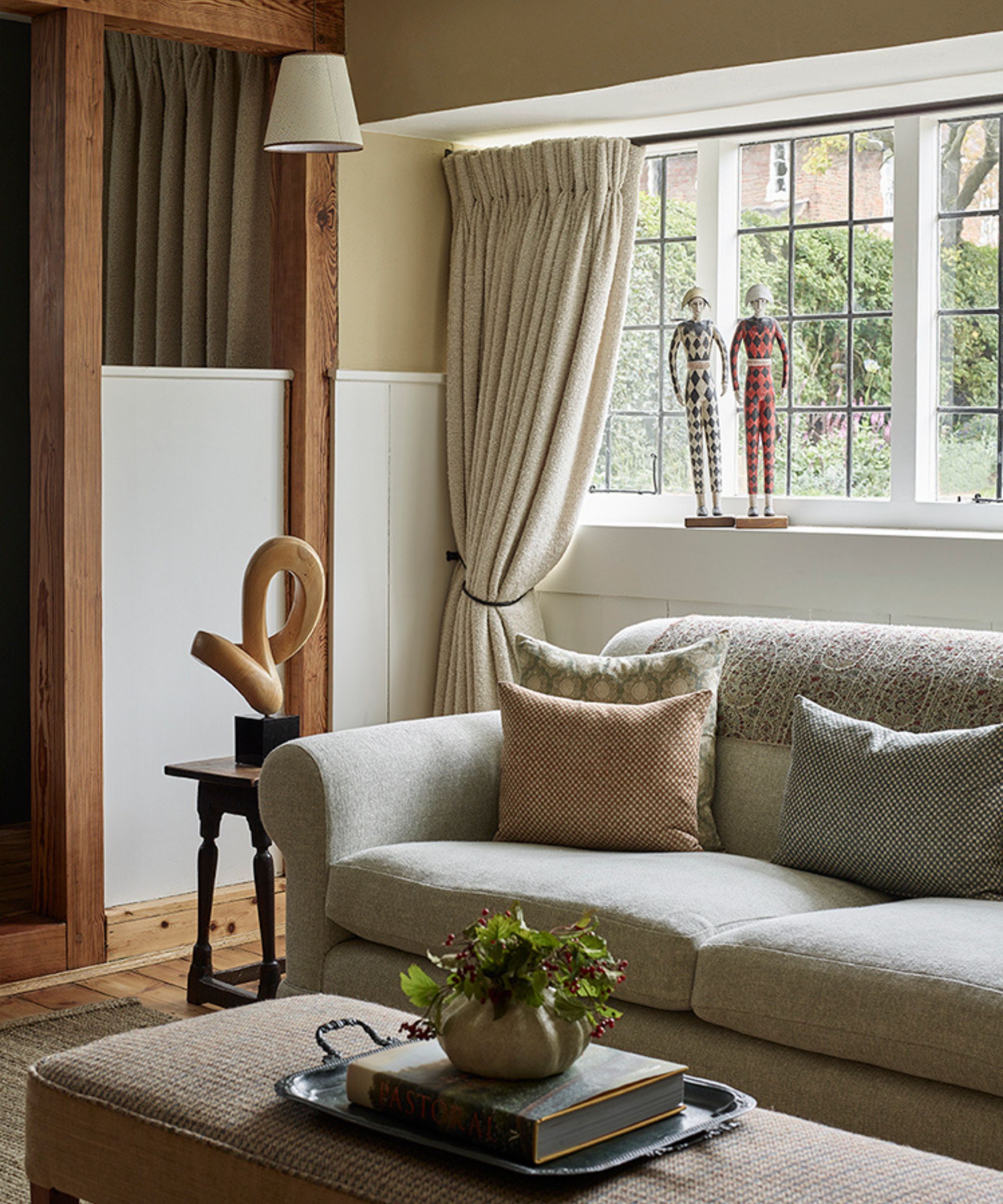 the corner of a pale yellow cottage living room in london