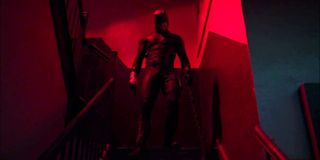 Daredevil (Charlie Cox) stands atop a stairwell on Daredevil