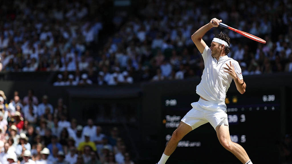 Taylor Fritz hits a forehand during his Wimbledon men's singles semifinal against Carlos Alcaraz