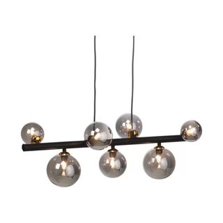 A statement geometric pendant light with 7 large glass domes