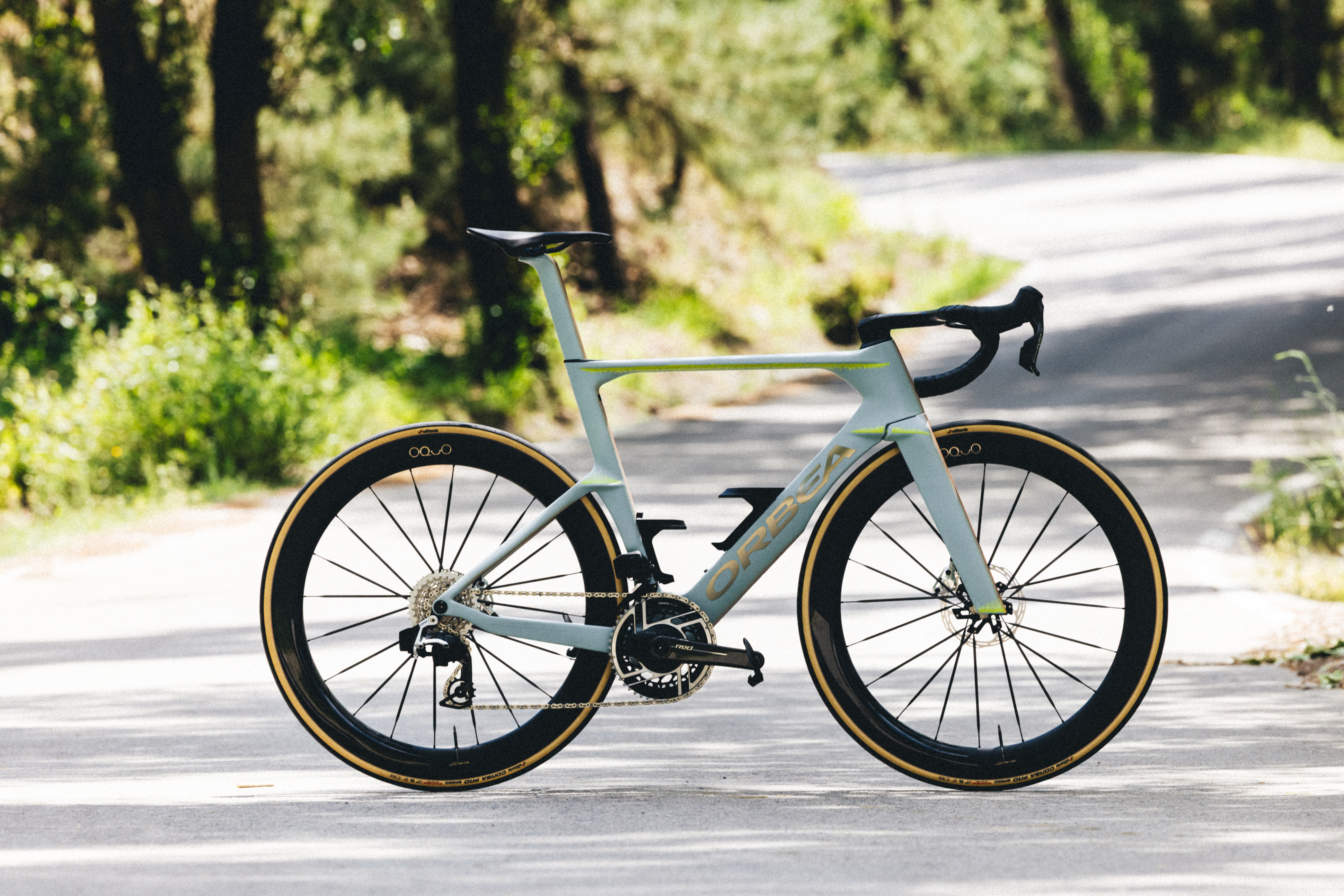 A pale green aero bike
