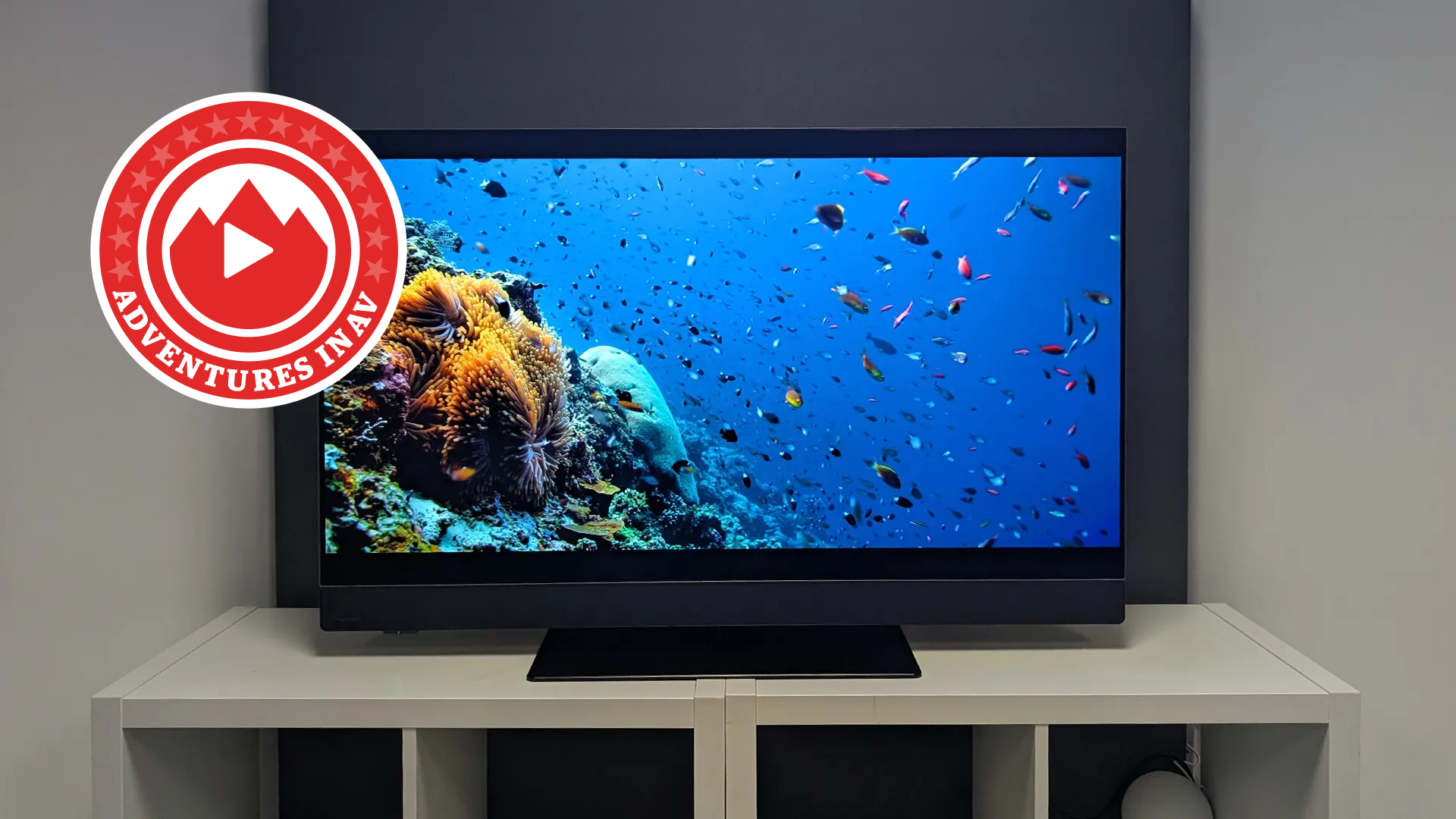 Panasonic Z90B on desk with Adventures in AV logo