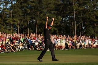 Phil Mickelson celebrates winning the 2010 Masters
