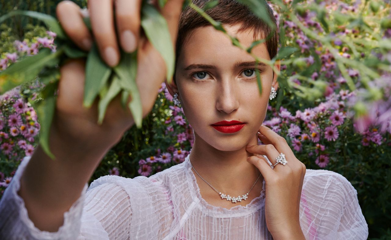 Woman against purple flowers