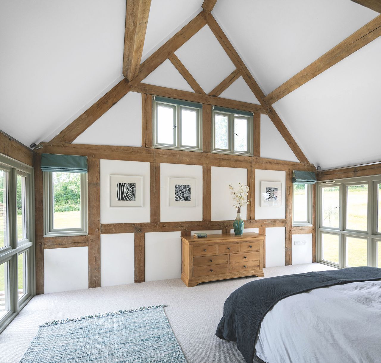 oak frame bedroom with vaulted ceiling