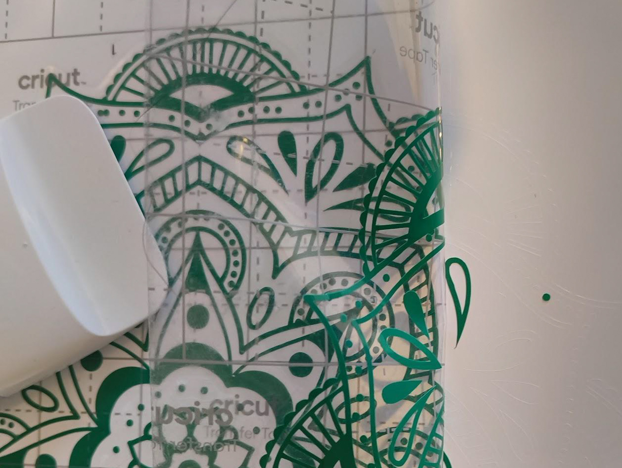 How to use Cricut transfer tape; photos of a person making a print design