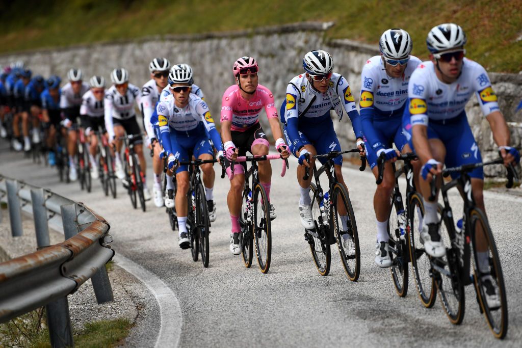 PIANCAVALLO ITALY OCTOBER 18 James Knox of The United Kingdom and Team Deceuninck QuickStep Joao Almeida of Portugal and Team Deceuninck QuickStep Pink Leader Jersey Mikkel Honore of Denmark and Team Deceuninck QuickStep Peloton during the 103rd Giro dItalia 2020 Stage 15 a 185km stage from Base Aerea Rivolto Frecce Tricolori to Piancavallo 1290m girodiitalia Giro on October 18 2020 in Piancavallo Italy Photo by Tim de WaeleGetty Images