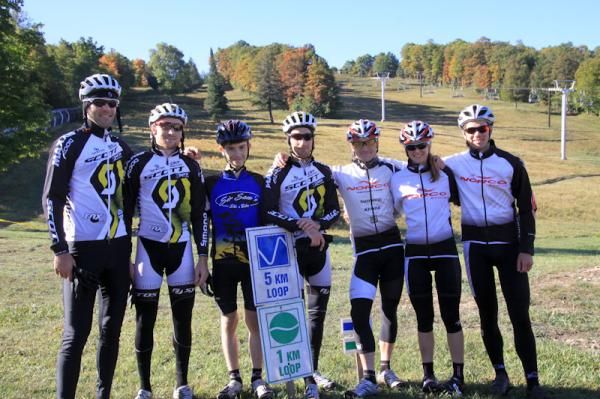 The pros pose with the youngest competitor
