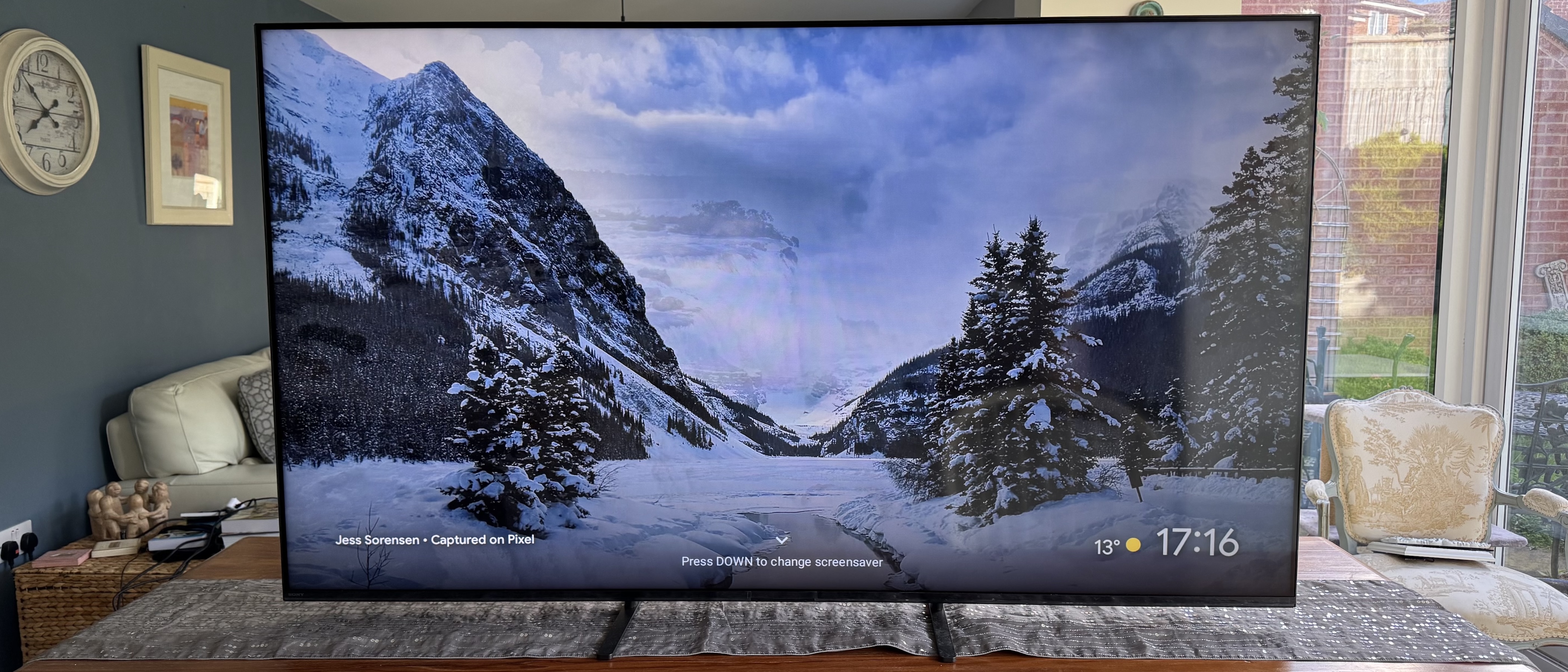 A close up of the Sony 65 Bravia 5 pictured on a wooden TV cabinet