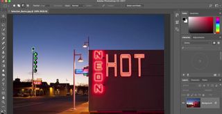 Photoshop tutorials: Photo of road featuring a number of neon hotel signs