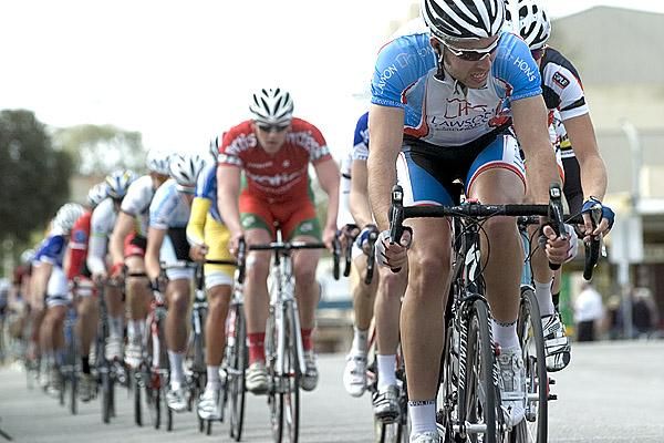 Will Robinson (Lawson Homes) grimaces on the front of the peloton as they try to pull back a leading trio.