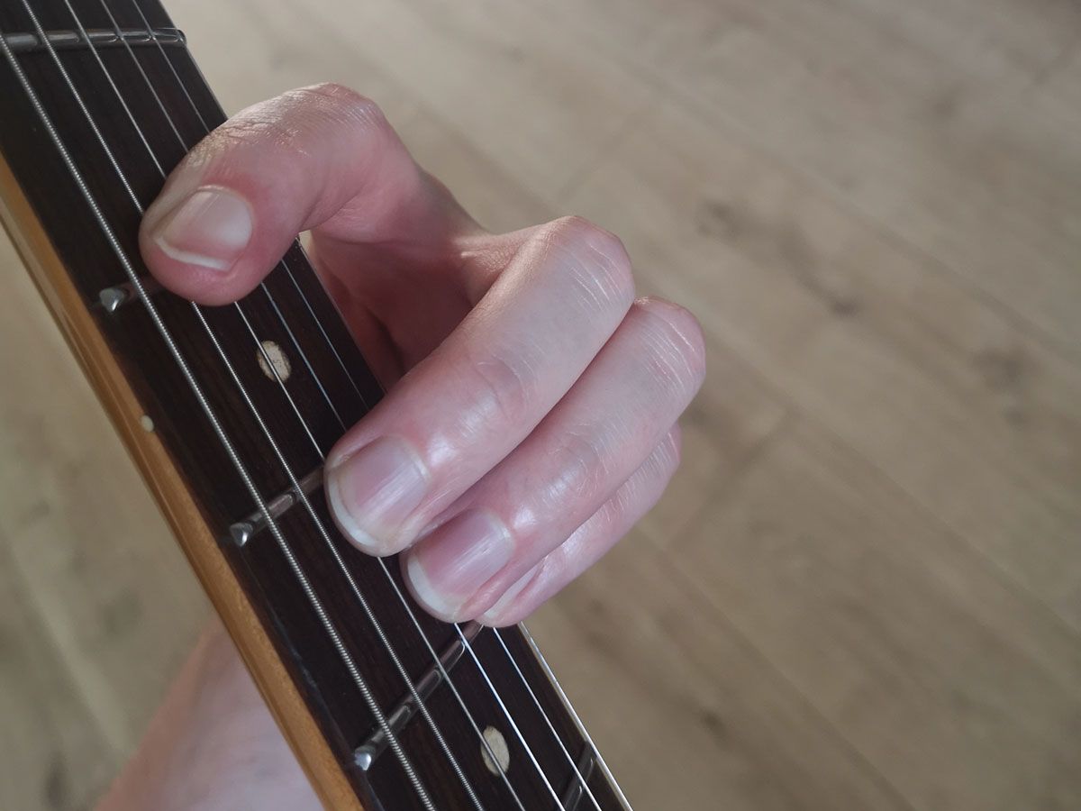 A demonstration of how to play the A-shape B major barre on guitar