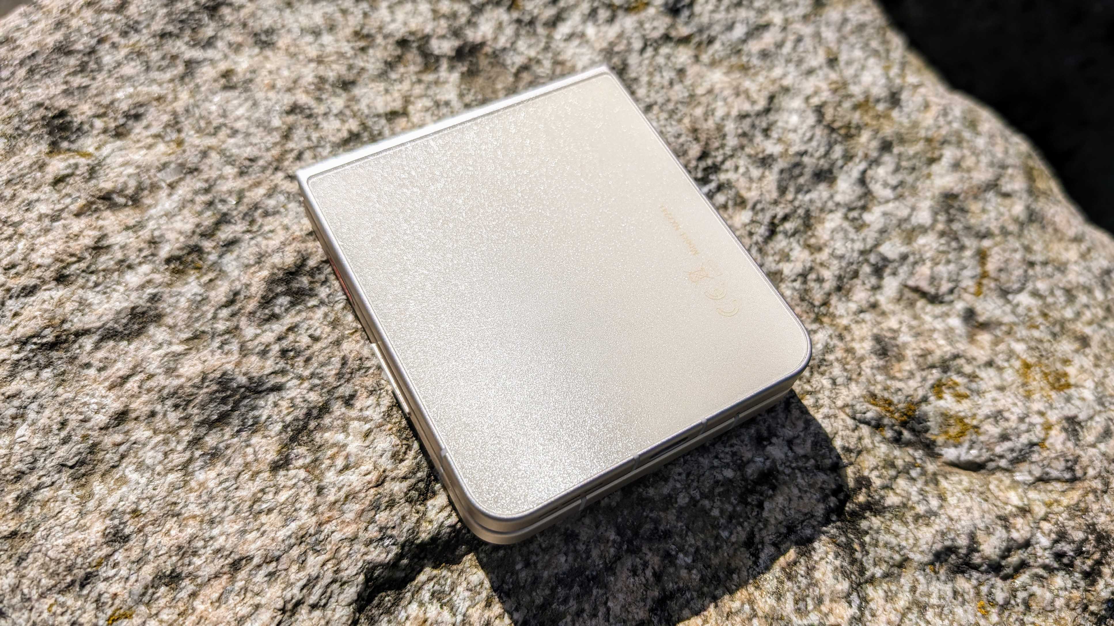 The back glass of the Nubia Flip 5G glistening form the sun