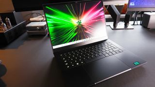 Razer Blade 14 gaming laptop on a desk.