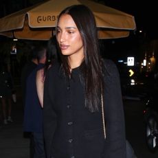 Jasmine Tookes wearing jeans and a cardigan out to dinner in L.A.