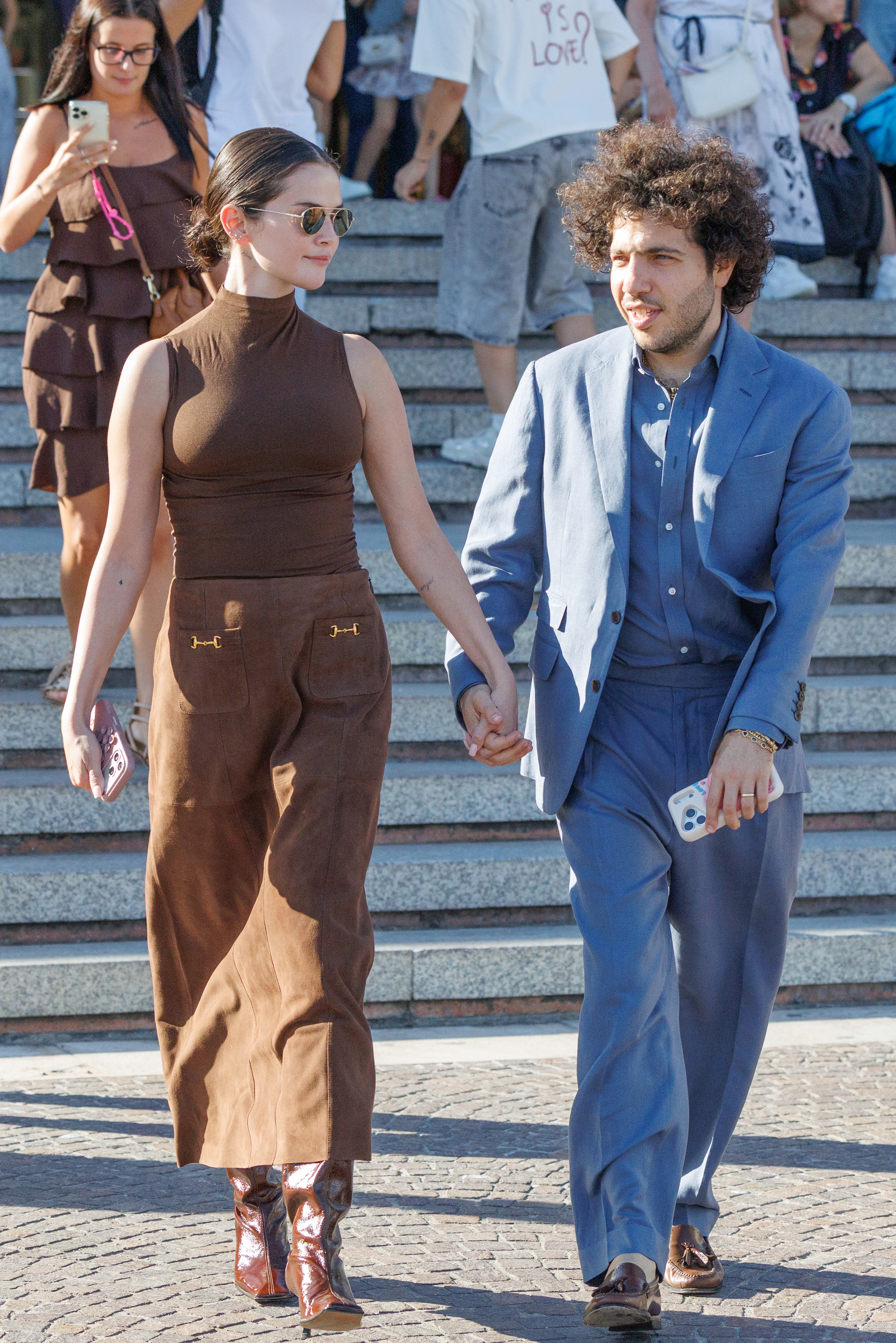 Selena Gomez styled a brown turtleneck with a matching suede maxi skirt and shiny fall boots