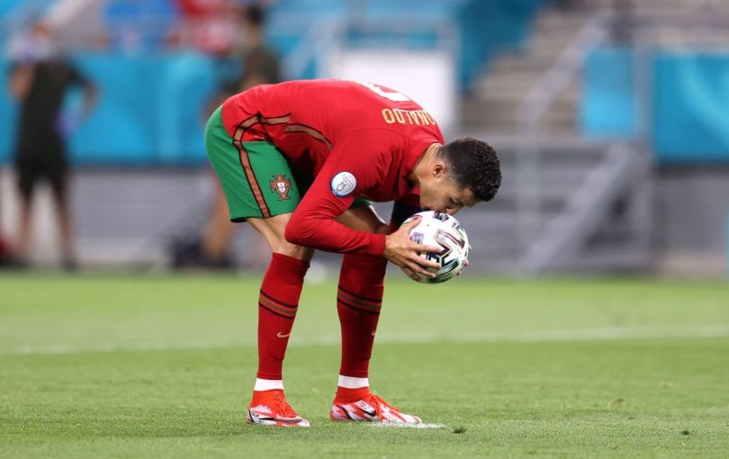 Cristiano Ronaldo kissing the ball before placing it on the penalty spot