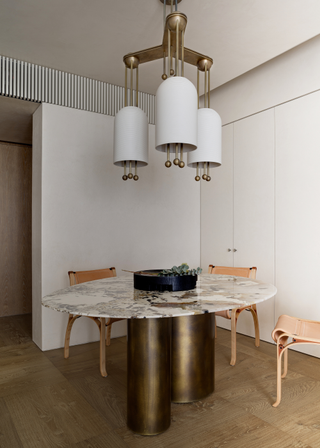 A dining room with a marble table