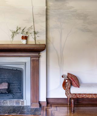 neutral wall mural with traditional fireplace and chaise lounge