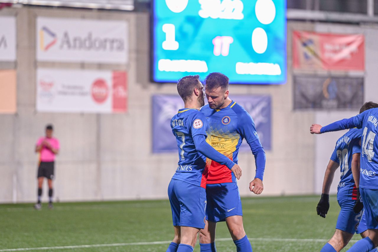 FC Andorra players celebrate a goal, 2022