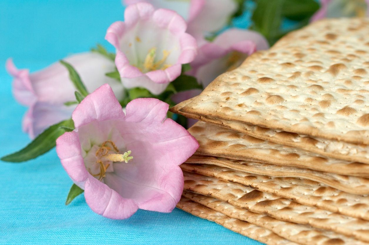 Flowers Next To Stack Of Crackers