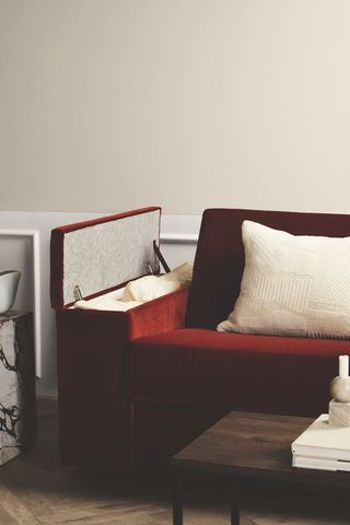 red sofa bed in a white living room
