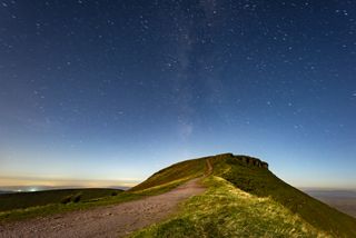 stars in the sky above a hill in the Brecon Beacons.