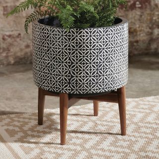 plant pot on wooden stool