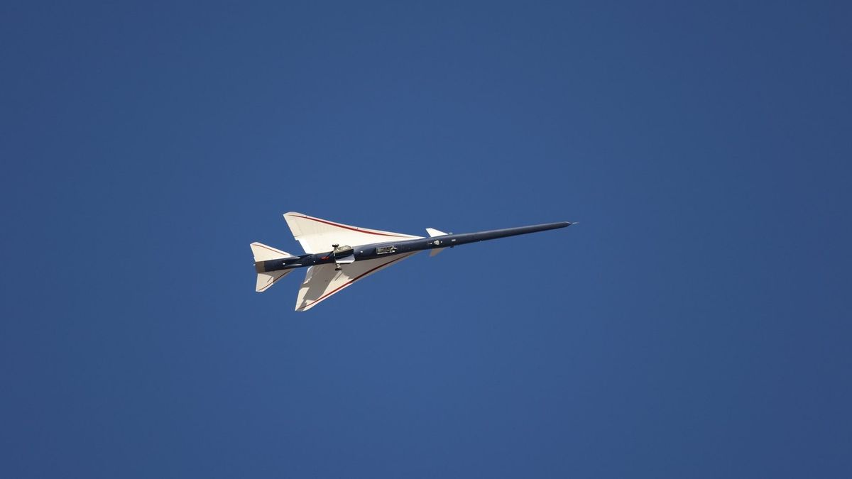 an elongated blue-and-white jet in flight