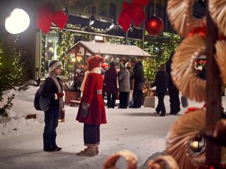 A boy and a girl wear winter outerwear in the snow in the movie the snow sister