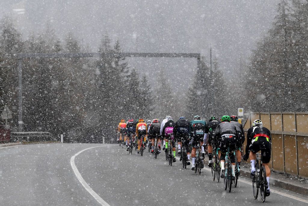 INNSBRUCK AUSTRIA APRIL 19 The Peloton passing through Brenner Brennero 1371m mountain during the 44th Tour of the Alps 2021 Stage 1 a 1406km stage from Brixen to Innsbruck Snow Landscape TourofTheAlps TouroftheAlps on April 19 2021 in Innsbruck Austria Photo by Tim de WaeleGetty Images